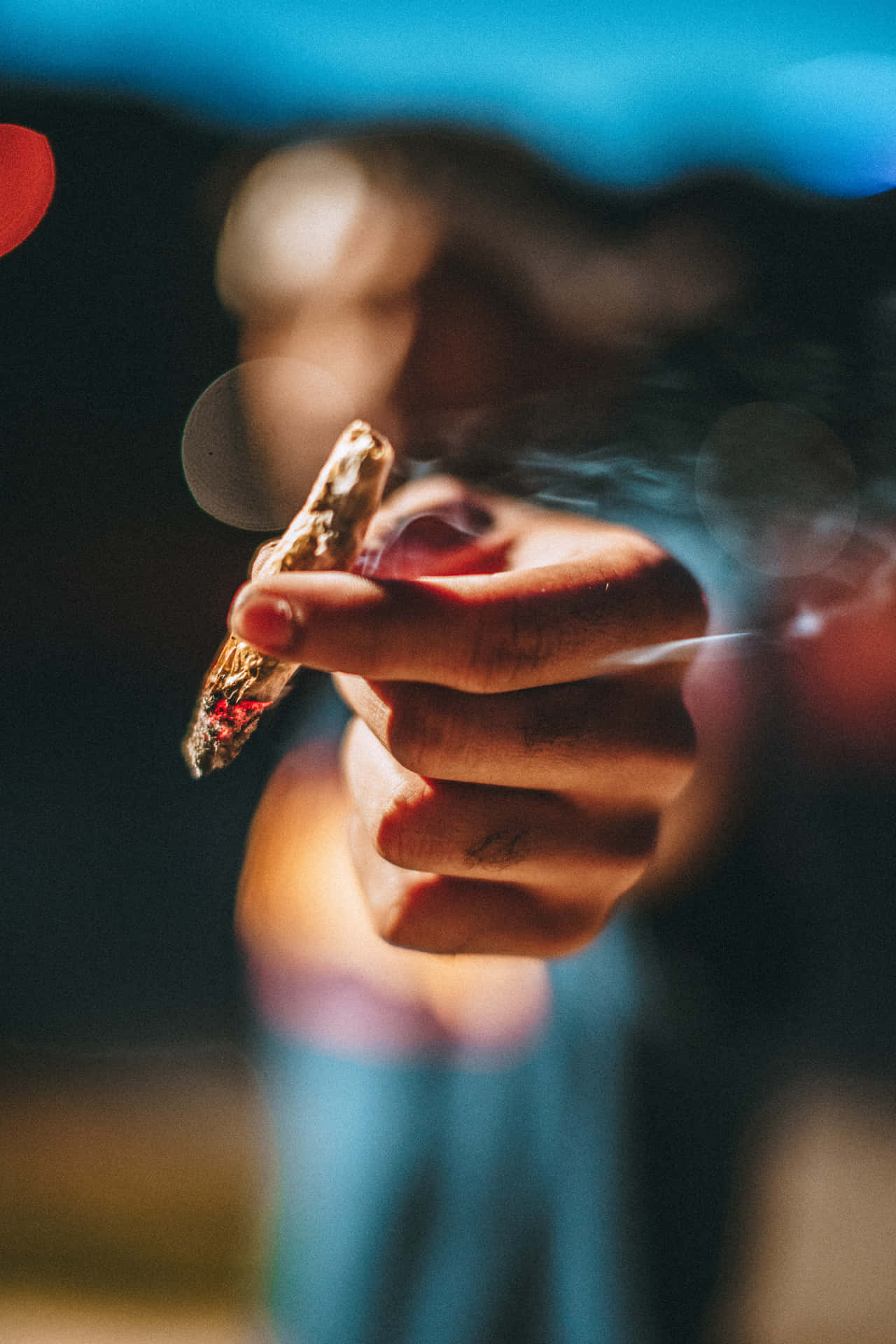 Person Holding A Joint Background