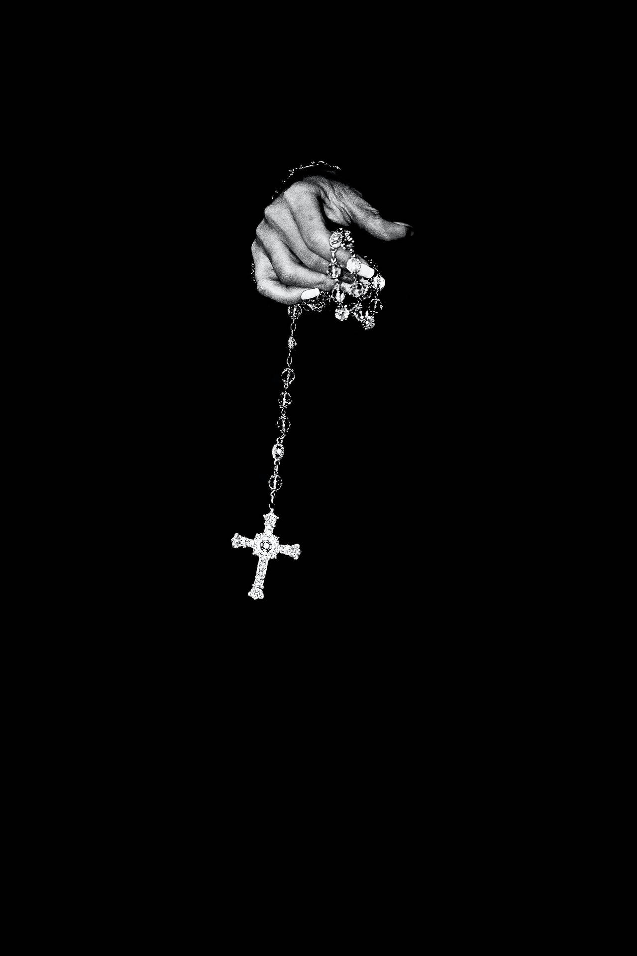 Person Holding Rosary Black Phone Background