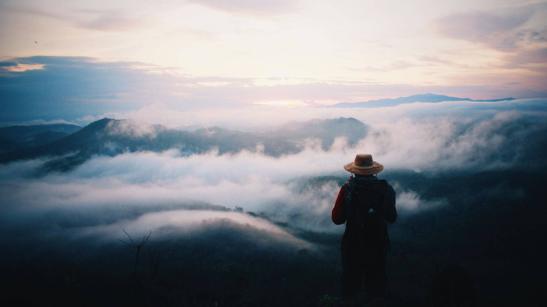 Person Journey Foggy Mountains Background