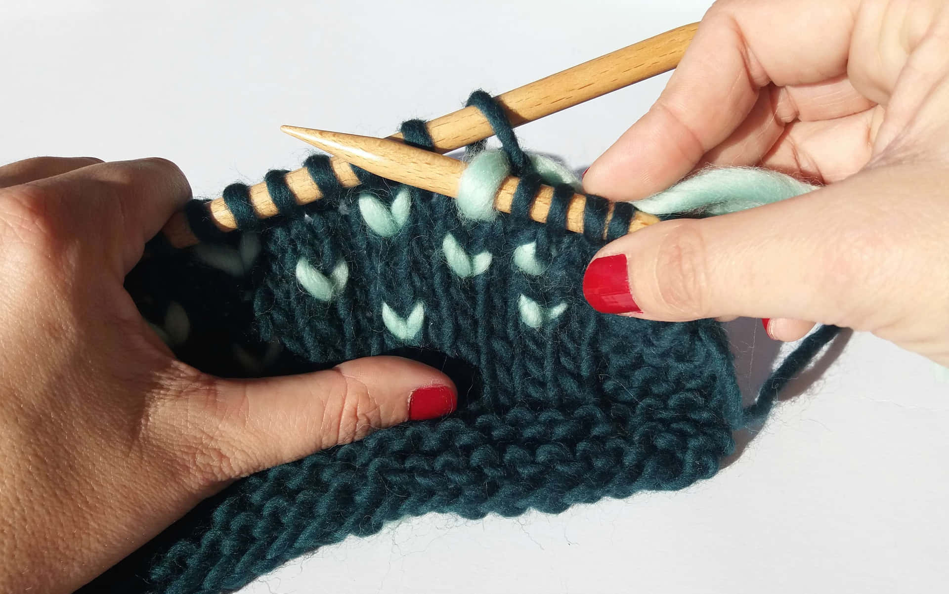 Person Knitting Dark Green Yarn