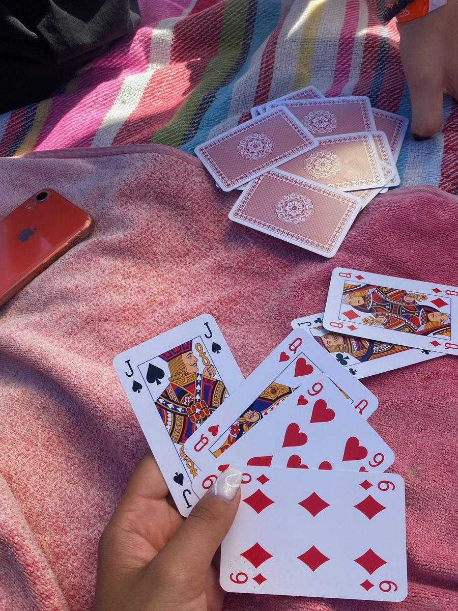 Person Playing Durak In Bed Background