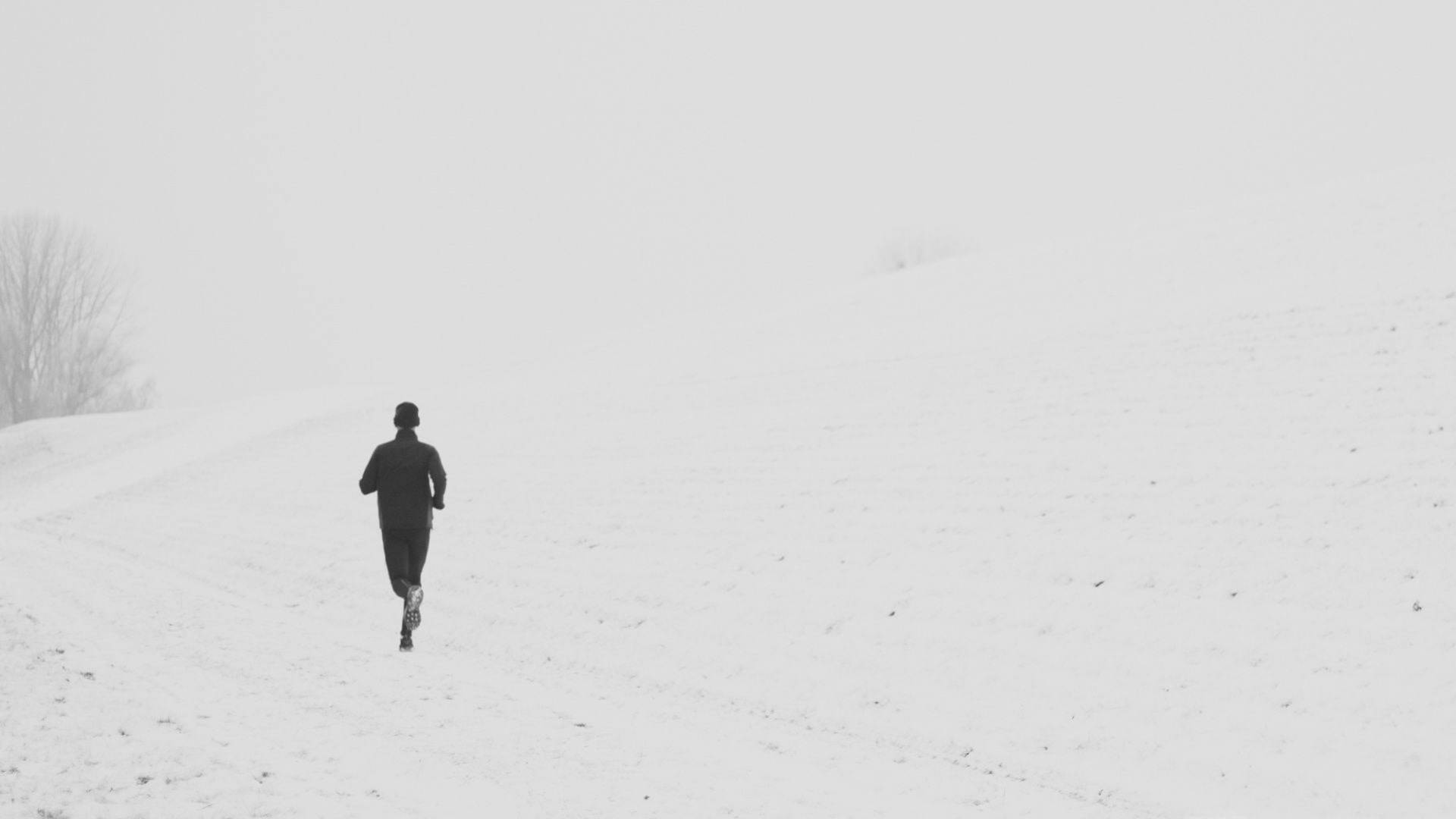 Person Running In Snow Road Background