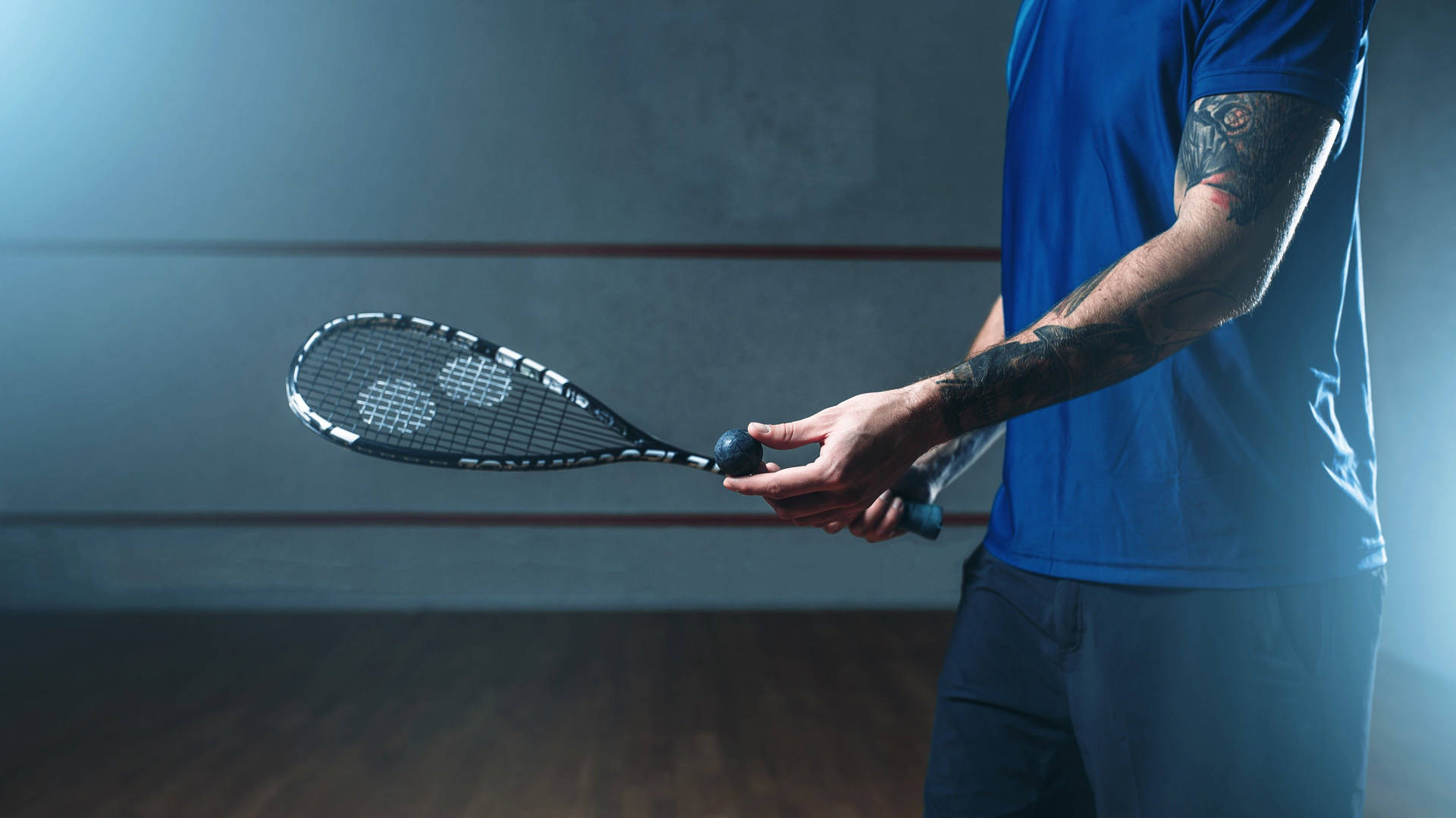 Person With Black Squash Racket