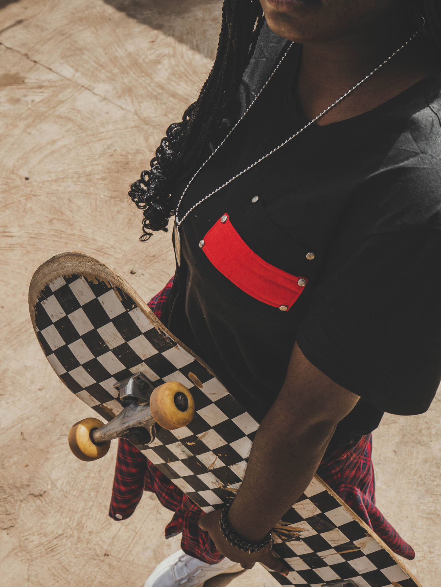 Person With Checkered Skateboard
