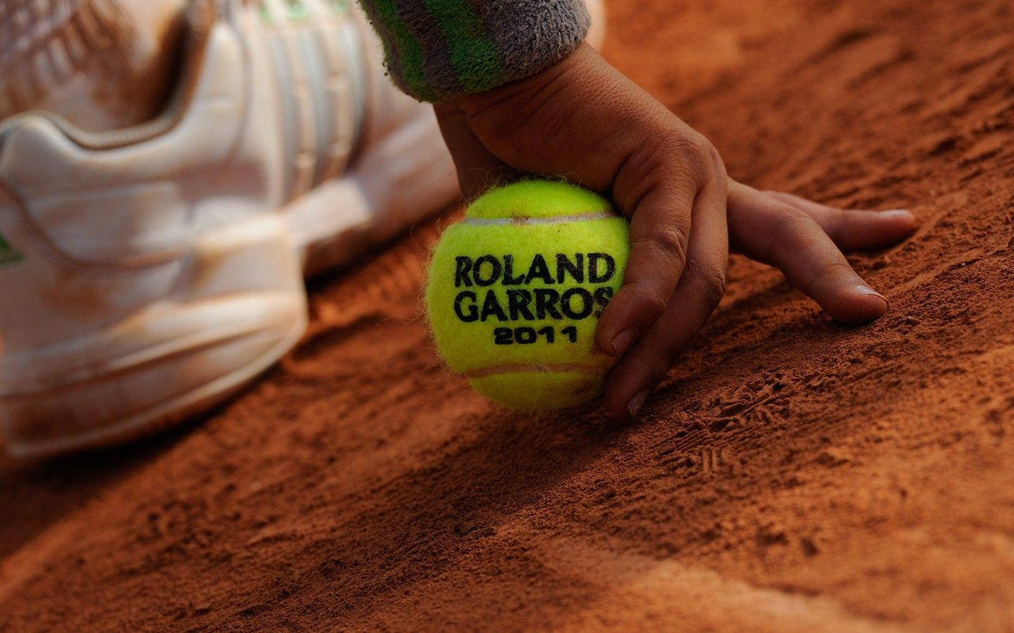 Person With French Open Tennis Ball Background
