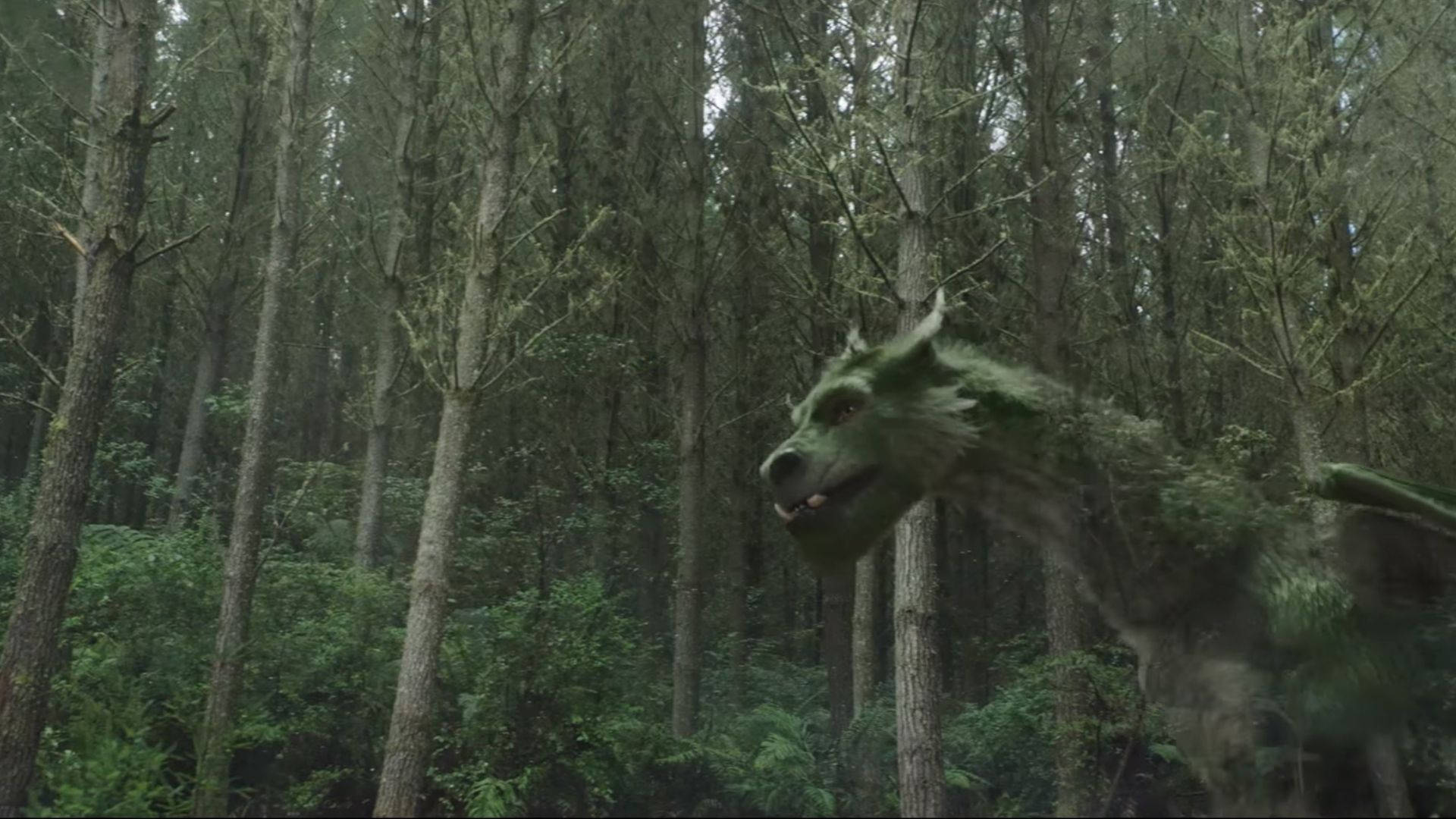 Pete's Dragon Walking In Woods Background