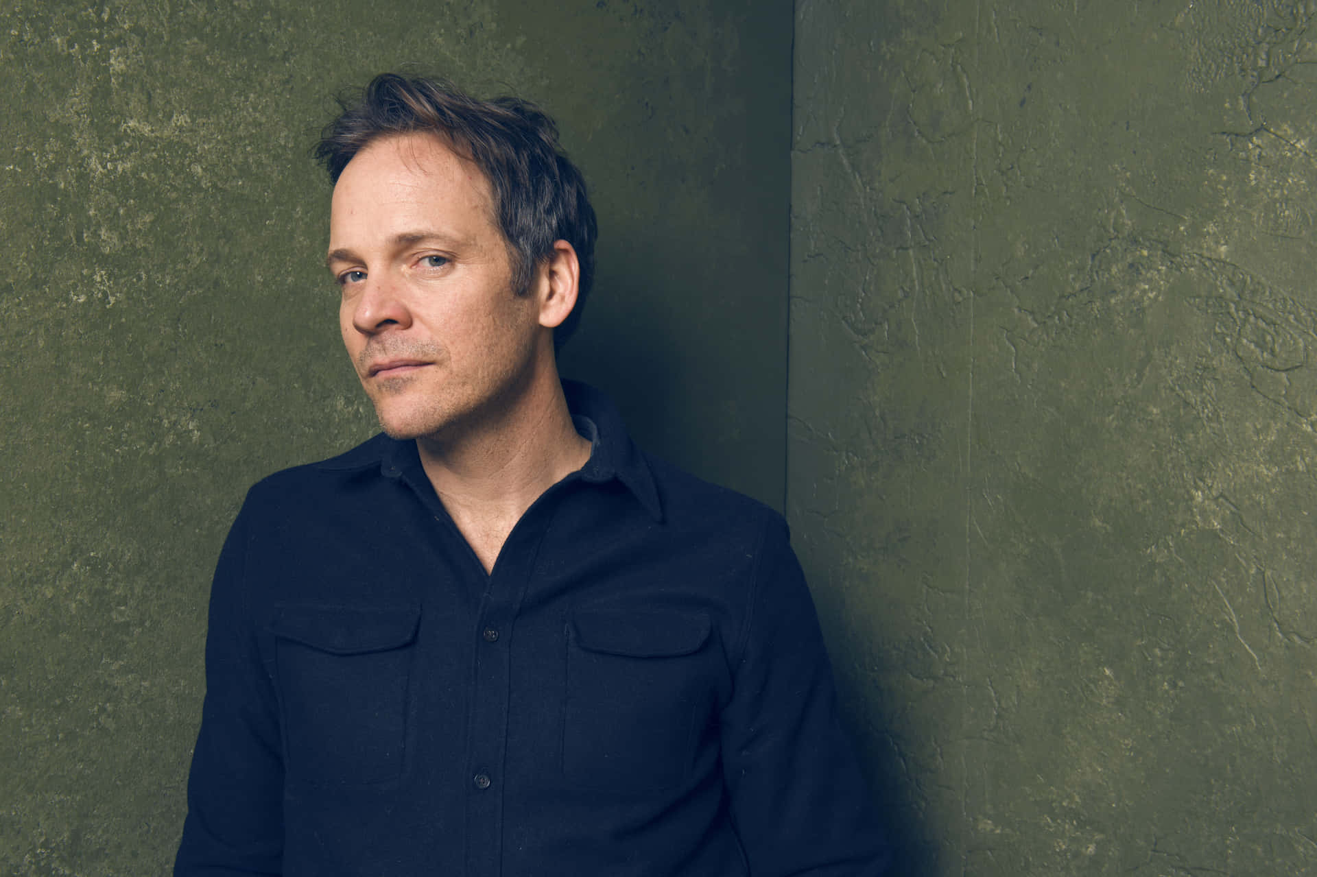 Peter Sarsgaard Looking Sharp In A Black Suit Background
