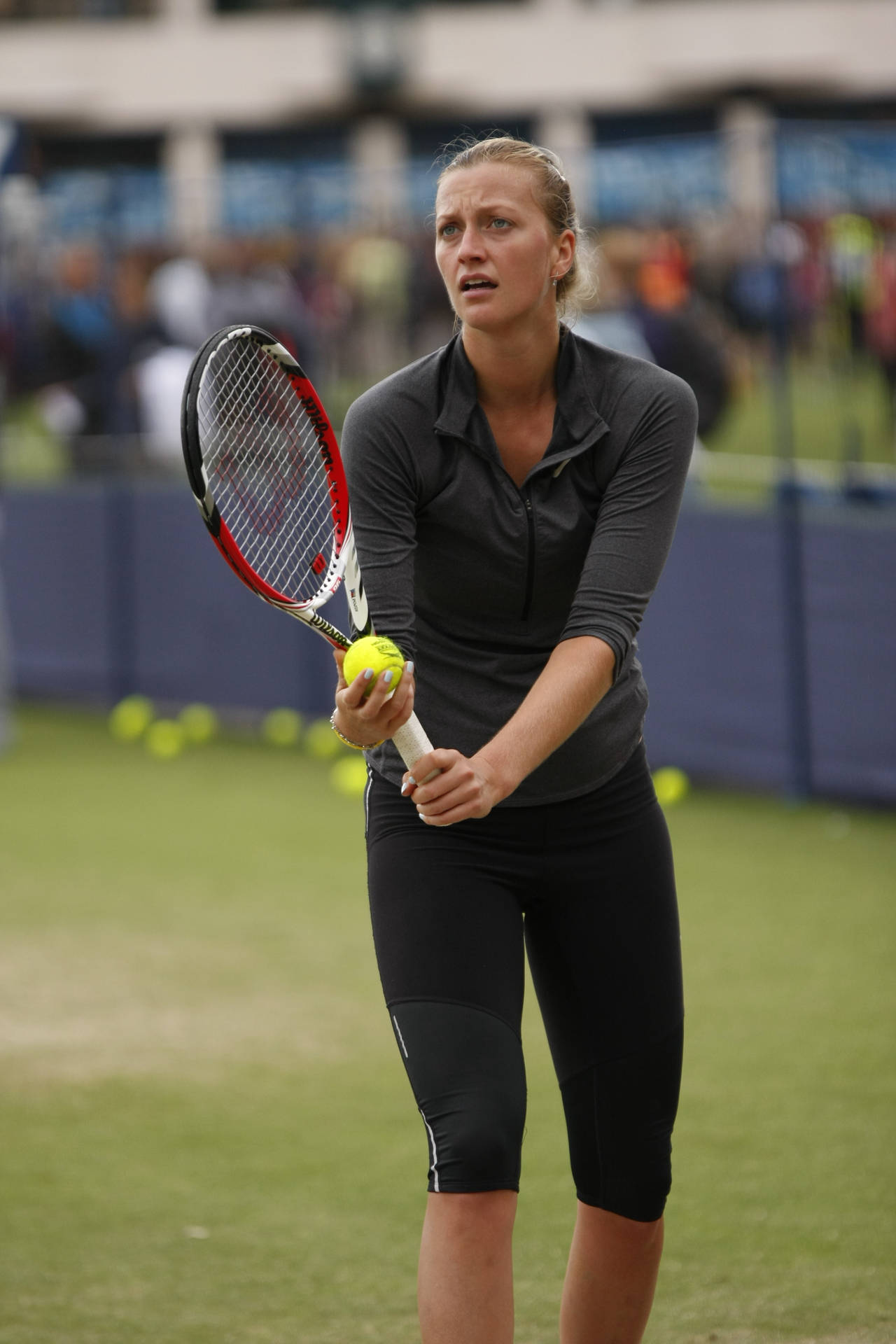 Petra Kvitova Gripping Tennis Racket Background