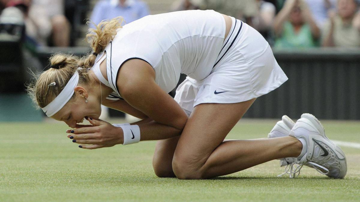 Petra Kvitova In Action During A Professional Tennis Match Background