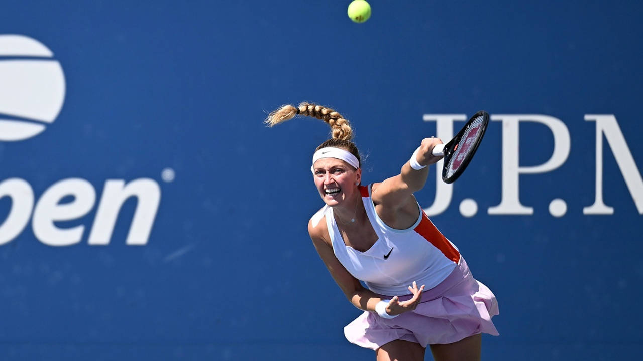 Petra Kvitova In Action During A Tennis Match Background
