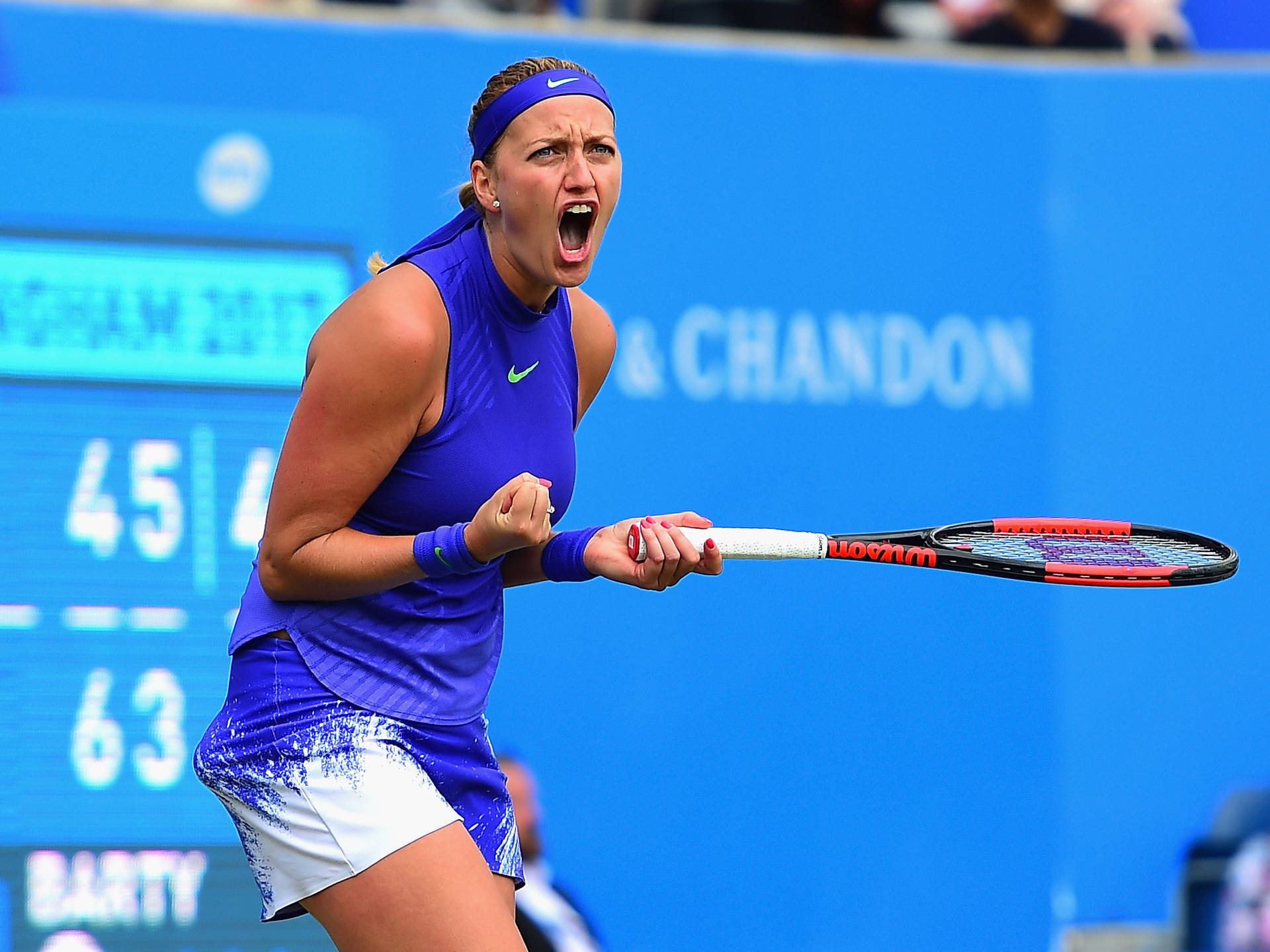 Petra Kvitova In Intense Tennis Match Background