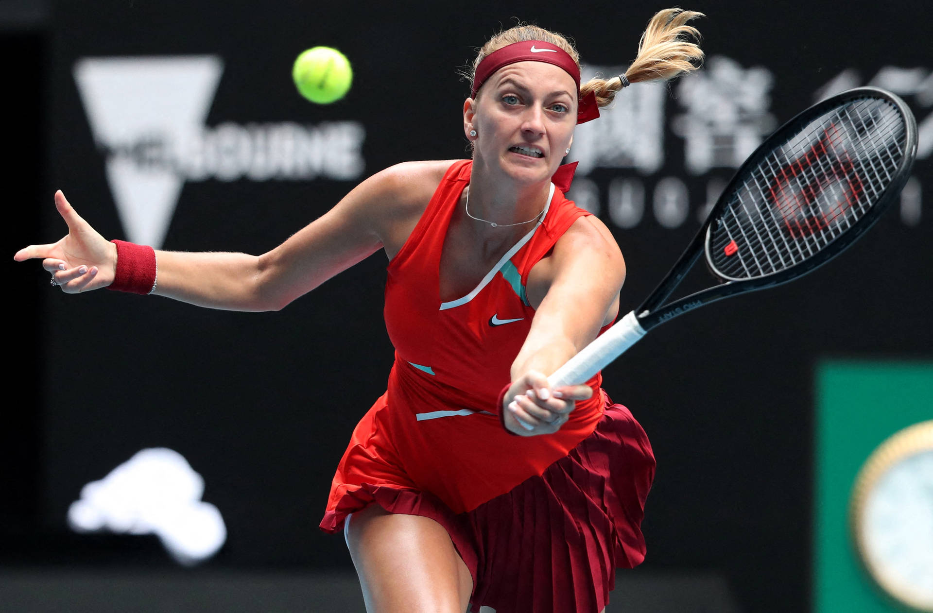 Petra Kvitova Running To Hit Ball Background