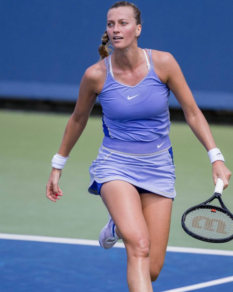Petra Kvitova Stepping Onto The Tennis Court Background