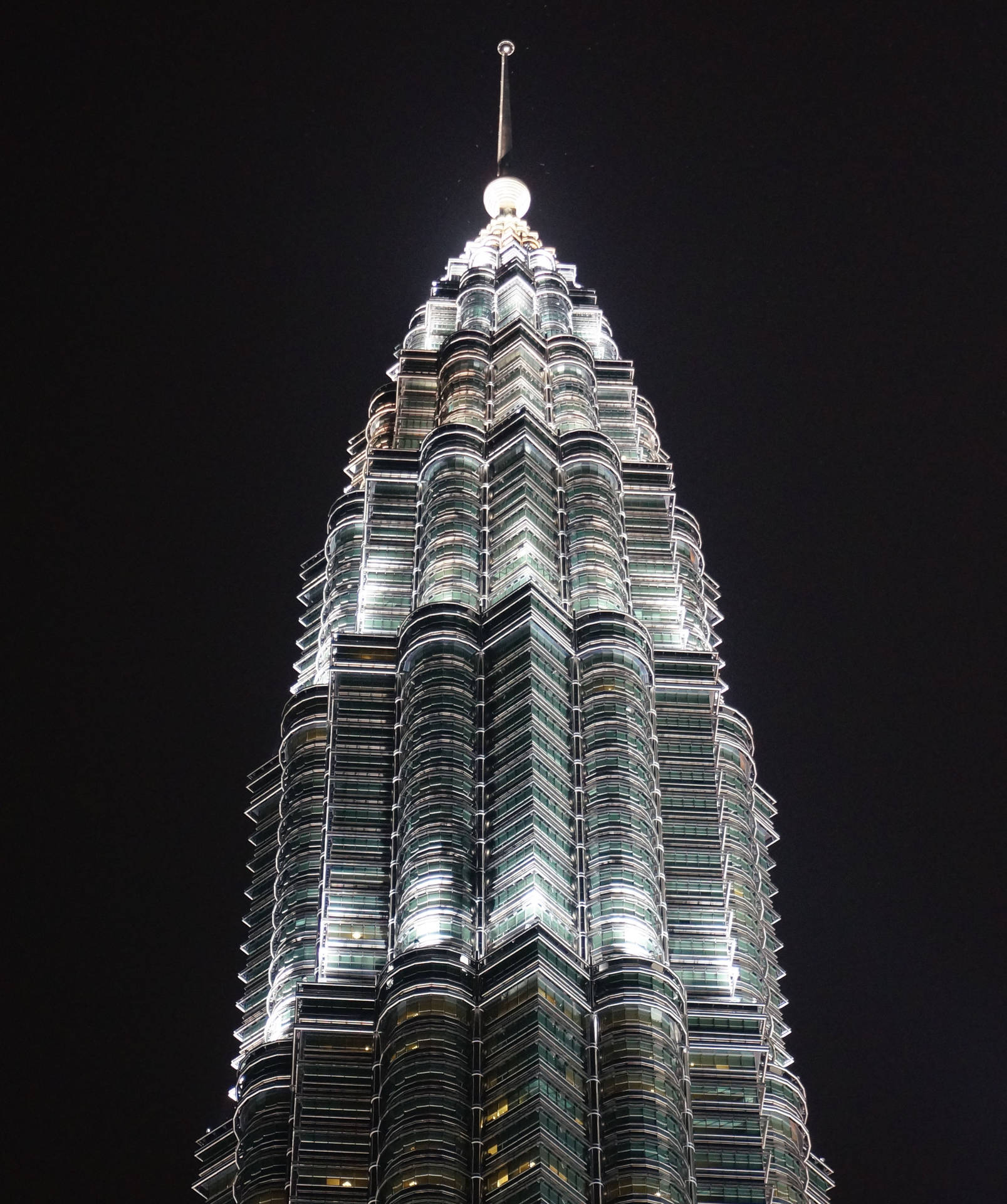 Petronas Twin Towers Illuminated At Night Background