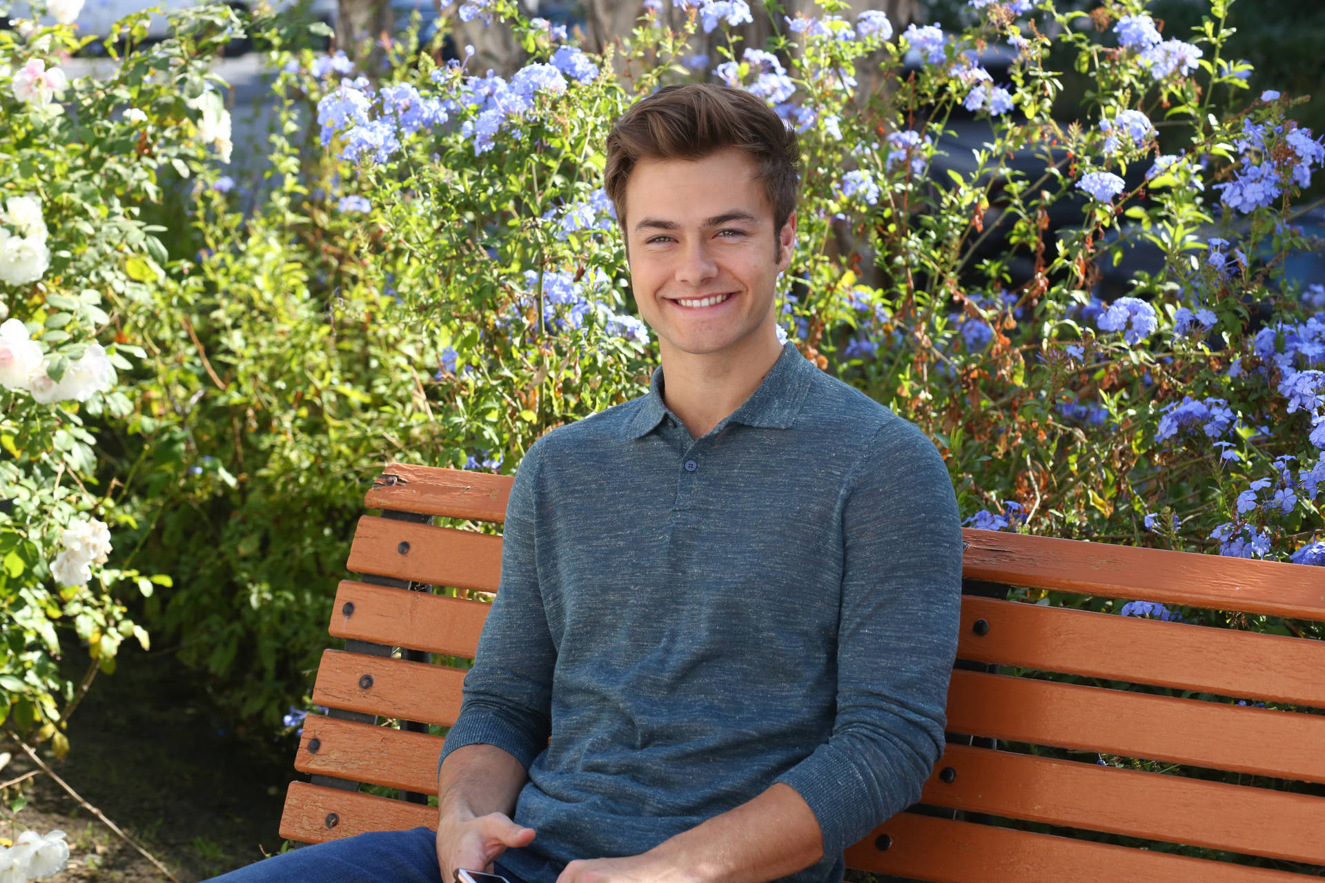 Peyton Meyer Sitting On Bench Background