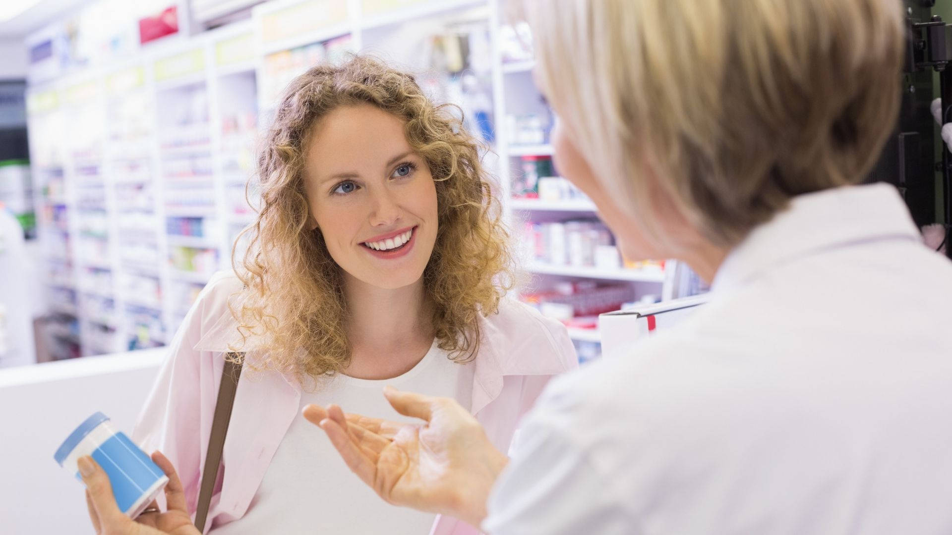 Pharmacist Explaining Medications To Client Background