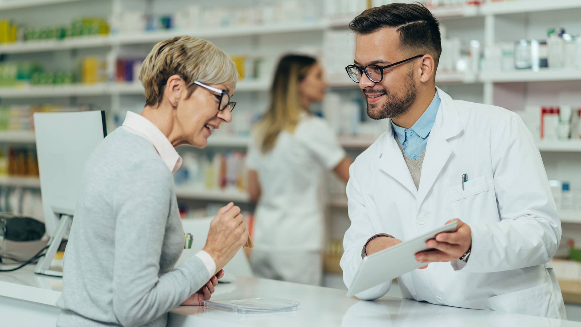 Pharmacist Explaining To Old Woman Background