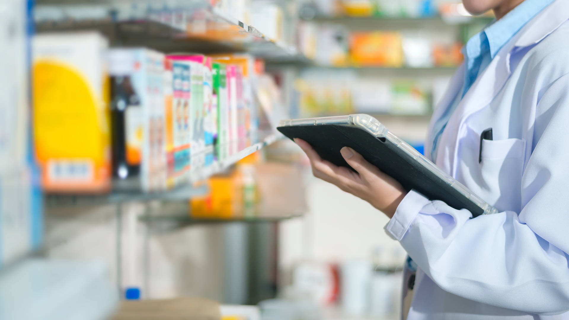 Pharmacist Holding Tablet Checking Medicines Background