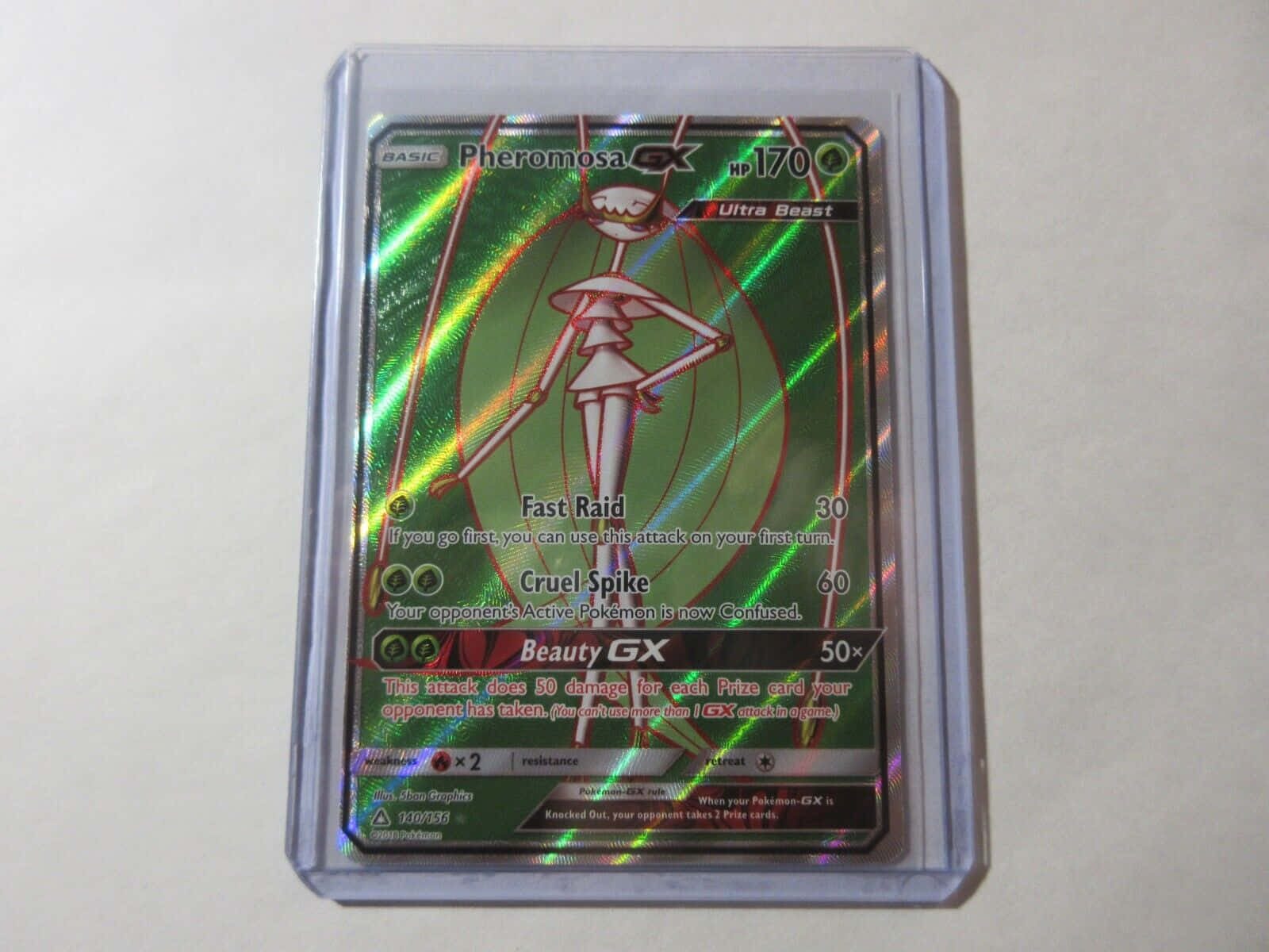 Pheromosa Pokémon Trading Card Encased In A Clear Protective Sleeve Background