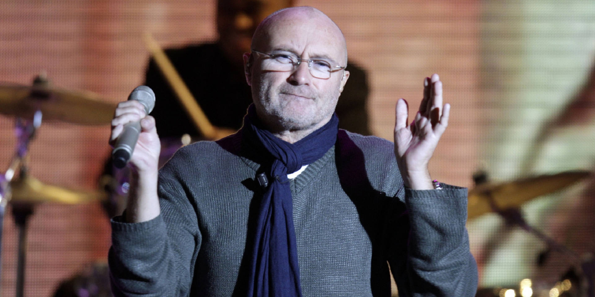 Phil Collins Clapping His Hands Background