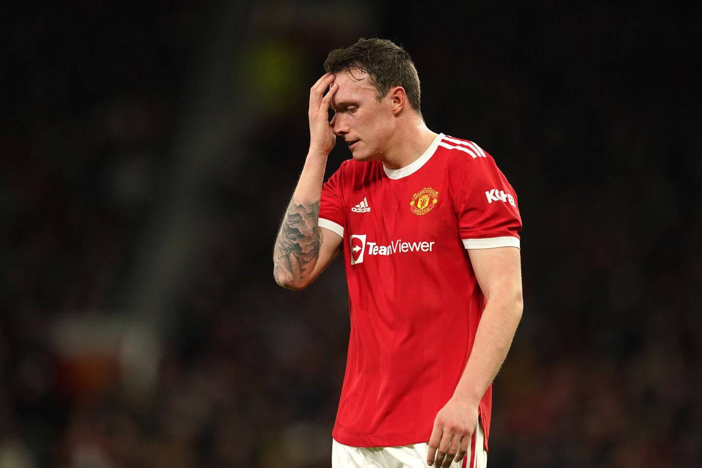 Phil Jones Facepalming During A Football Match. Background