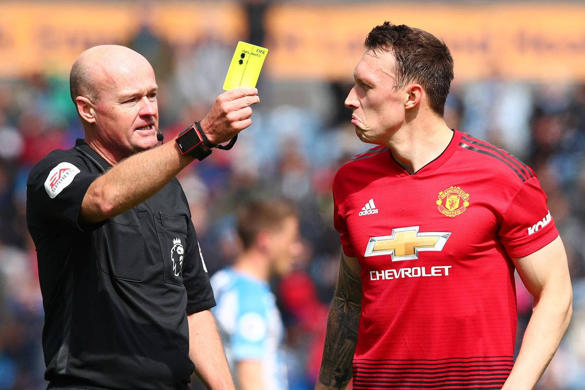 Phil Jones Getting Yellow Card Background