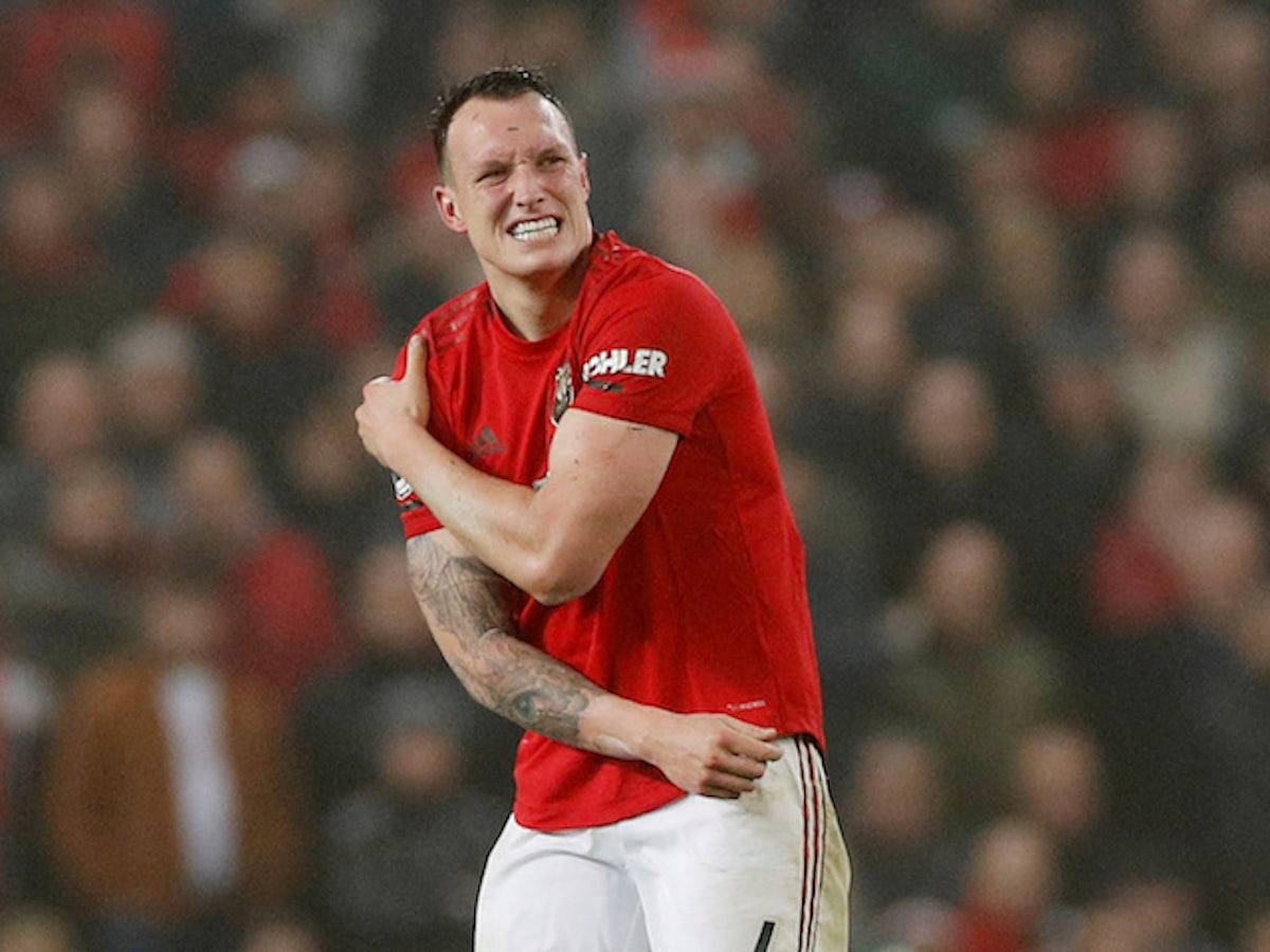 Phil Jones Holding Right Arm