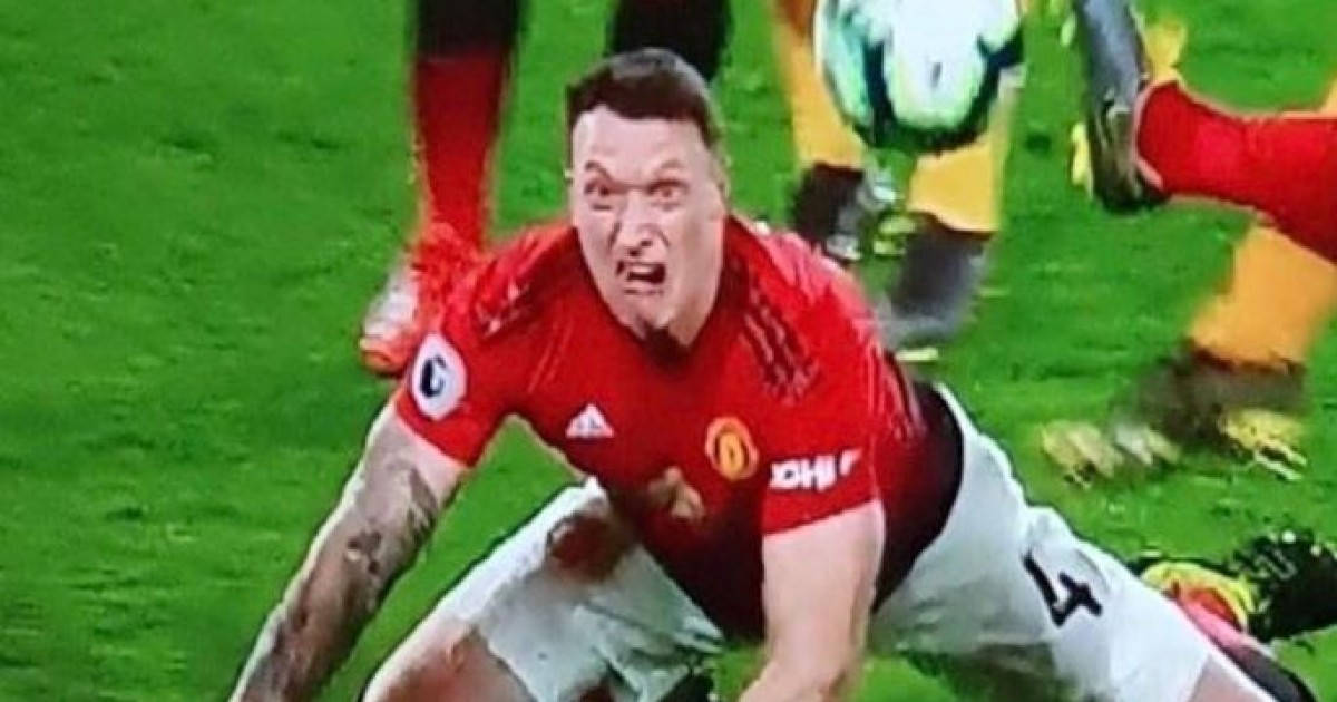 Phil Jones In Action On The Football Field Background