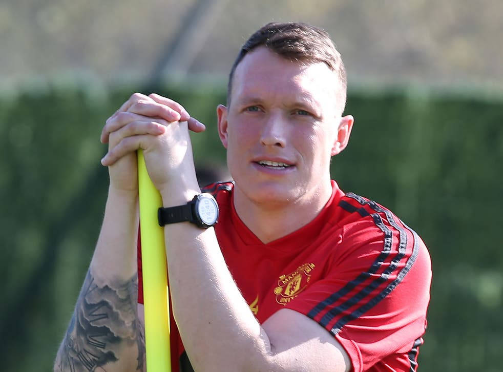 Phil Jones Training With A Yellow Pole