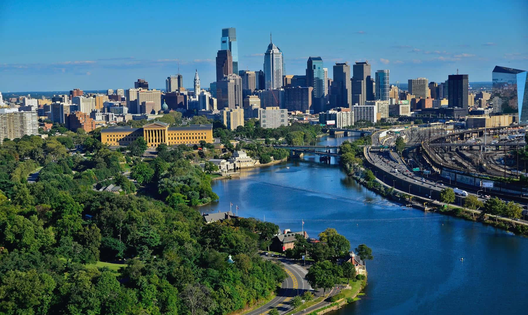 Philadelphia Skyline With Blue River Lake Background