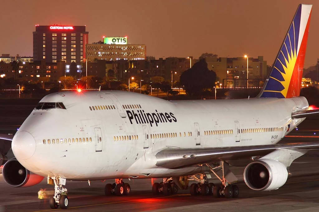 Philippine Airlines Airplane In City Airport Background