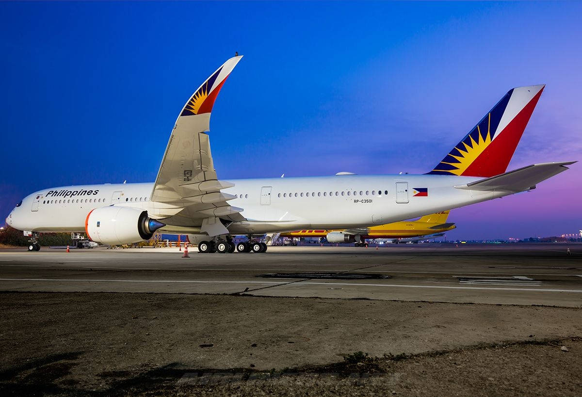 Philippine Airlines Airplane On Runway Background