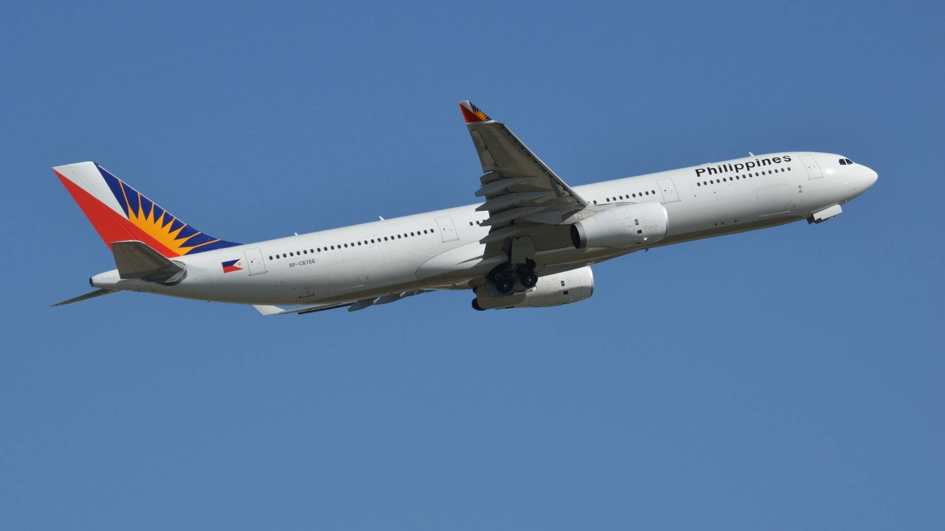 Philippine Airlines Gliding Airplane Wings Background