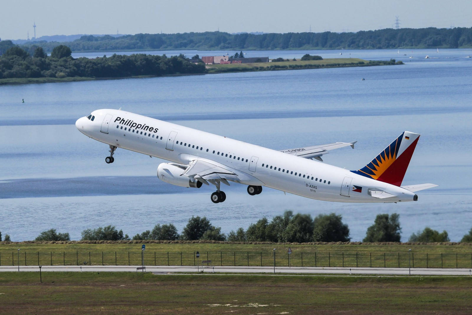 Philippine Airlines Plane Taking Off With Lake View Background