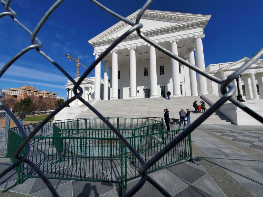 Photo Of Virginia State Capitol Taken Outside The Wired Fence Background