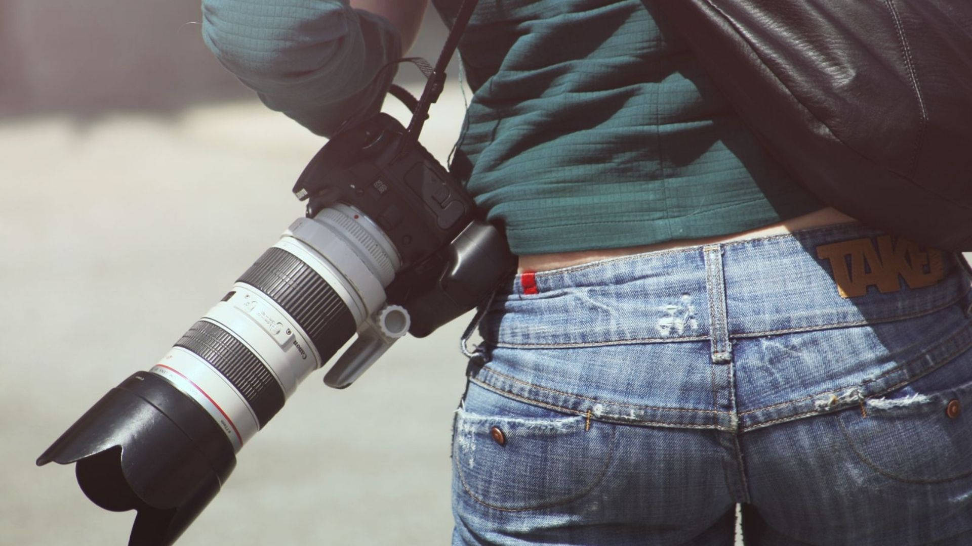 Photographer Carrying A Camera Background