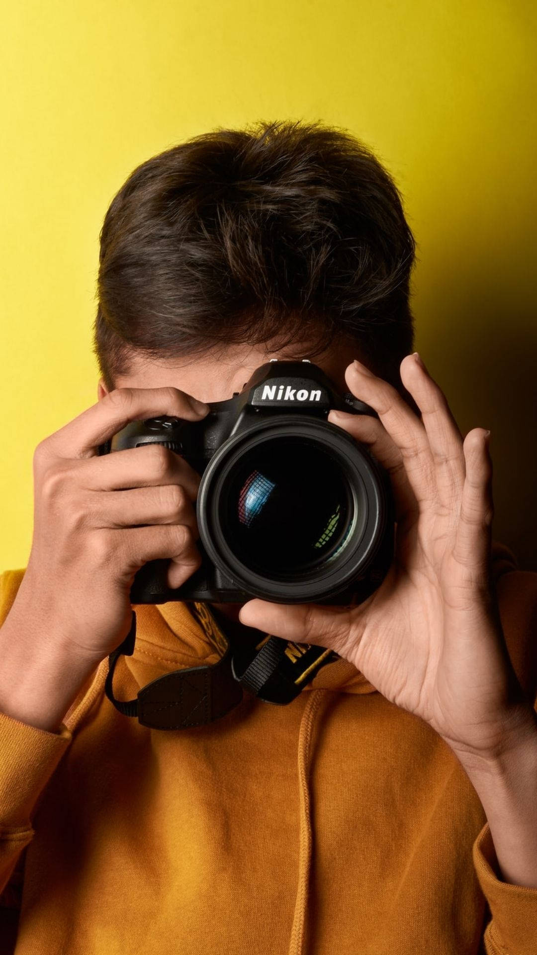 Photographer In Yellow Background