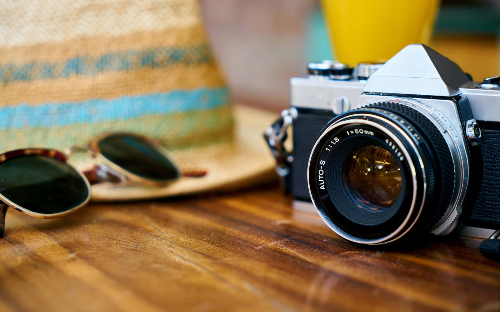 Photography Camera With Sunglasses And Hat Background