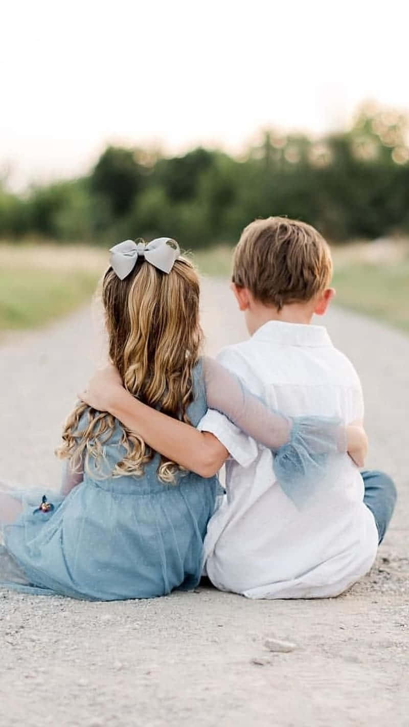 Photography Of Boy And His Cute Sister Background