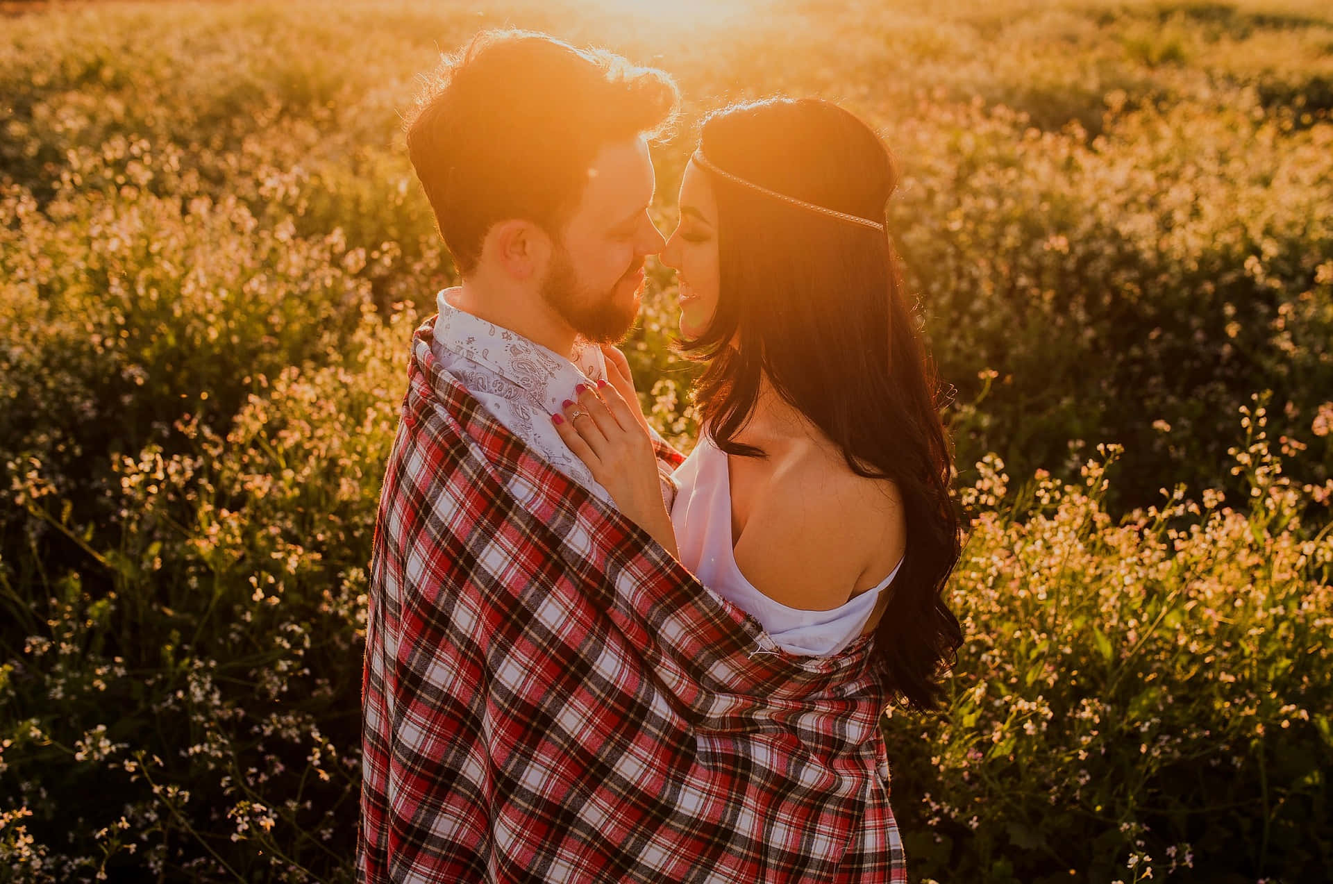Picture Of A Couple Tangible Facing Each Other Closely On A Flower Field Background