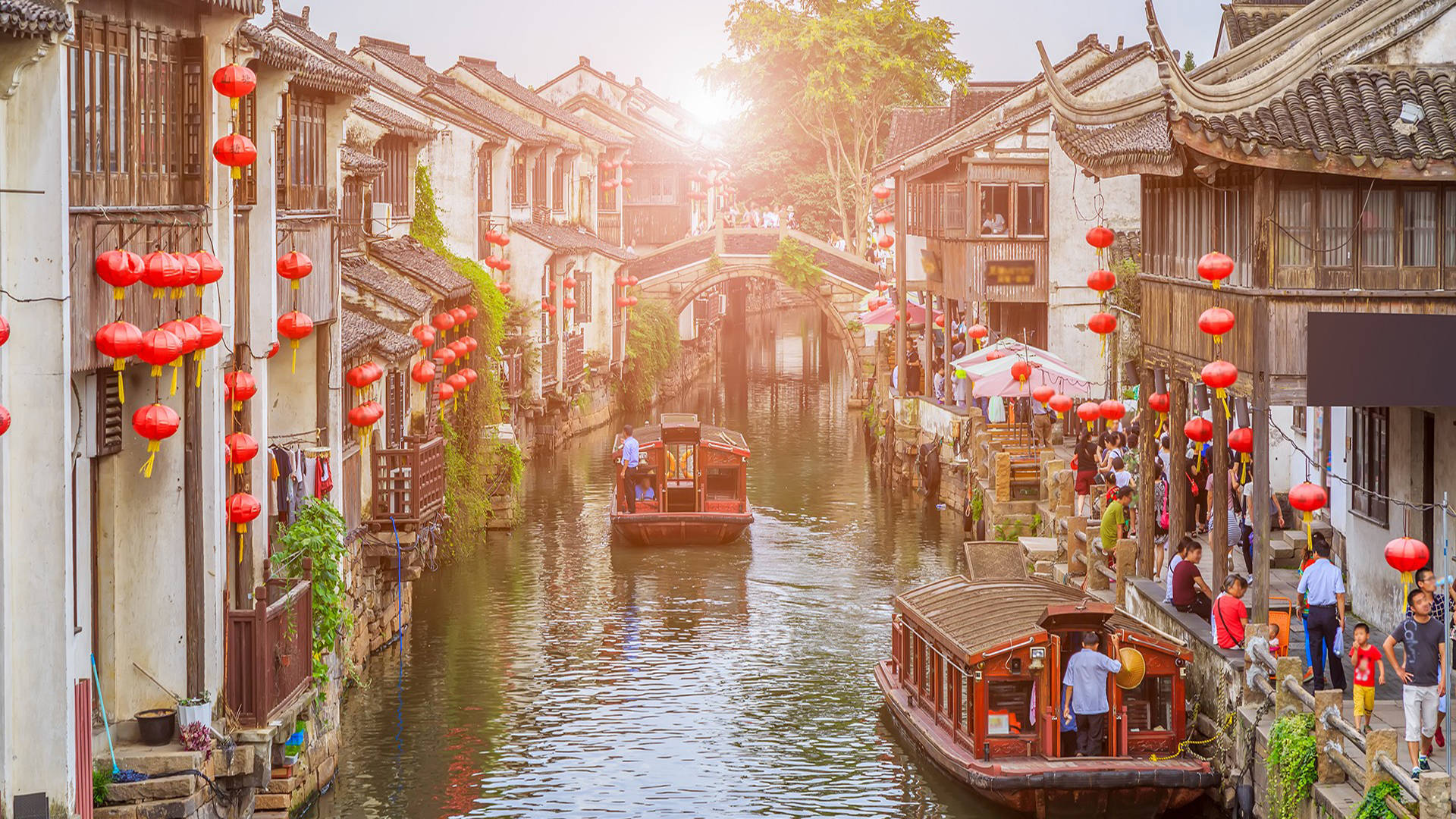 Picturesque Suzhou Canal At Sunset Background