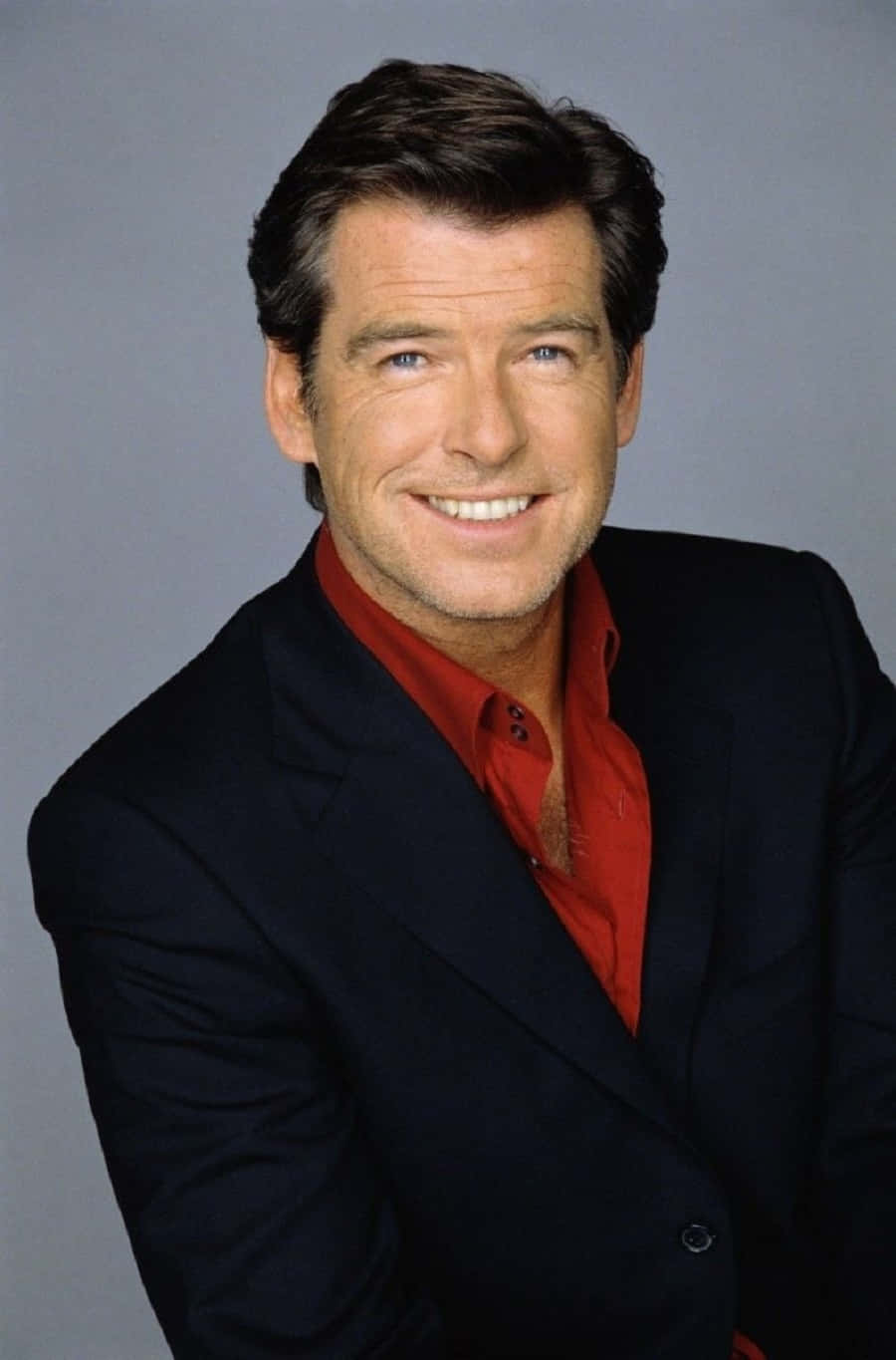 Pierce Brosnan Charming In A Tuxedo Background