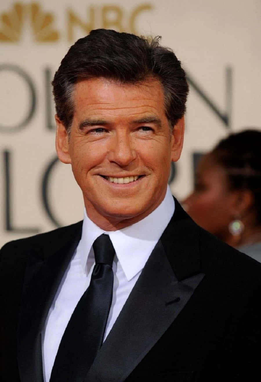 Pierce Brosnan In A Smart Suit Background