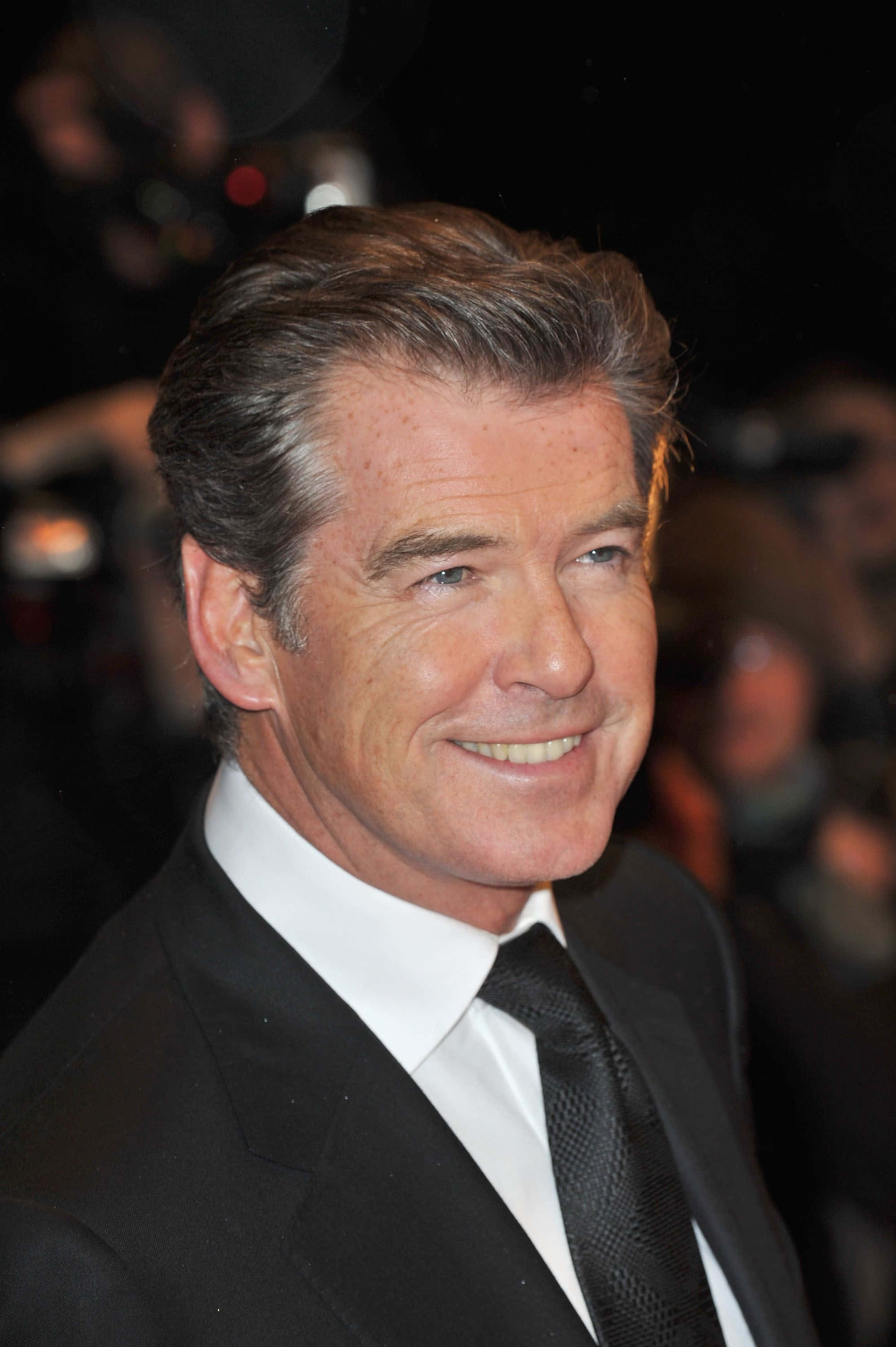 Pierce Brosnan Looking Dashing In 1996 Background