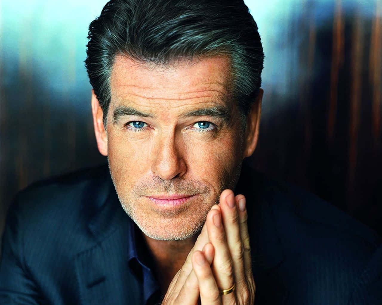 Pierce Brosnan Smiling During Cannes Film Festival Background