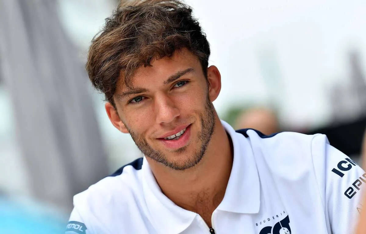 Pierre Gasly - F1 Ace In A Cool White Polo Shirt Background