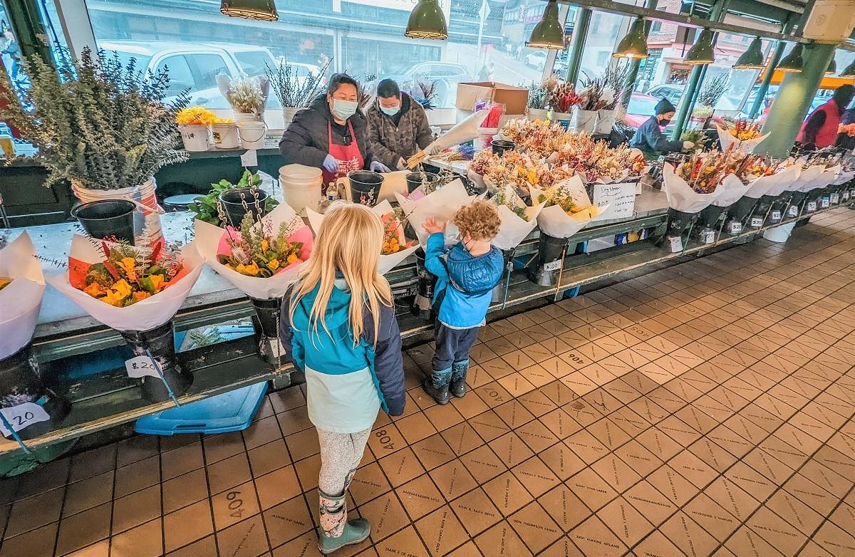 Pike Place Market Kids And Flowers Background