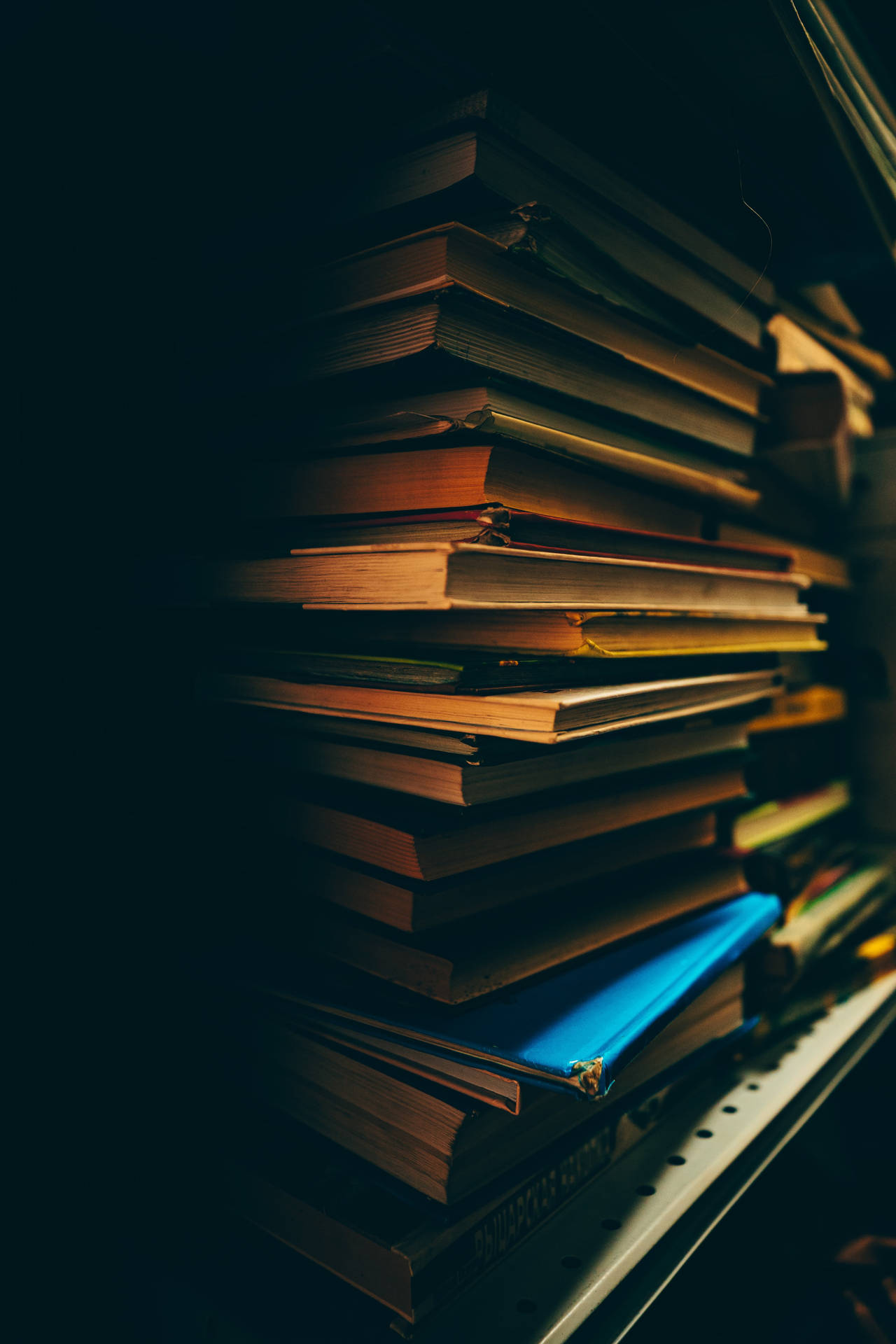 Pile Of Books In The Dark Background