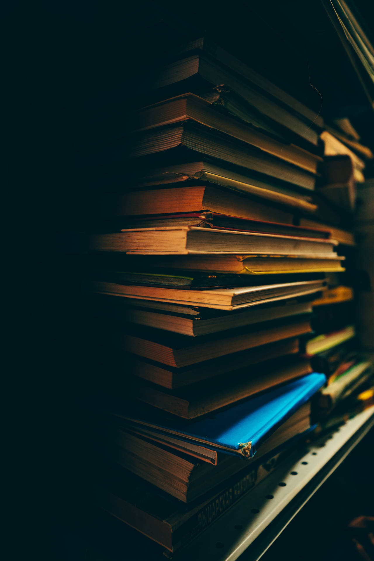 Pile Of Books In The Dark