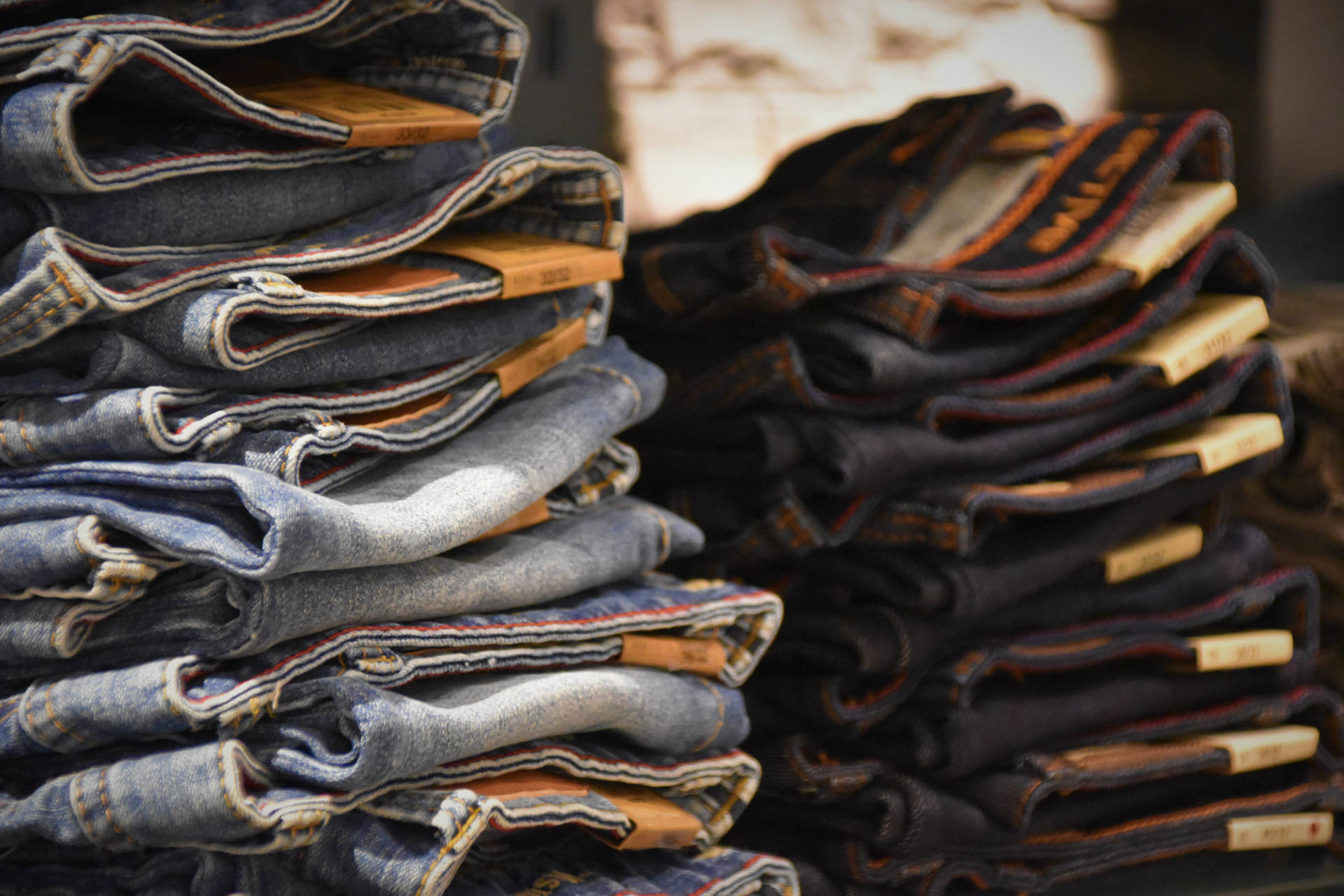 Pile Of Denim Jeans In Different Colors